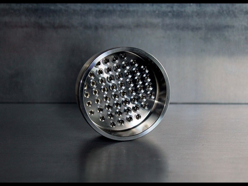 Cylindrical part with holes