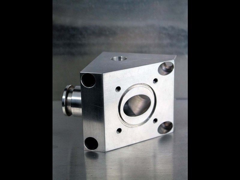 Side view of triangular piece with hole in center