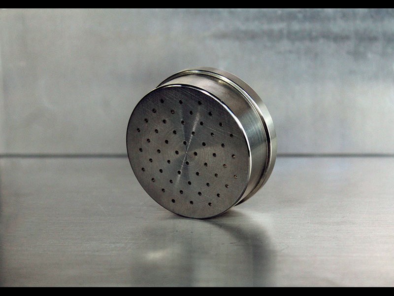 Front view of cylindrical part with holes